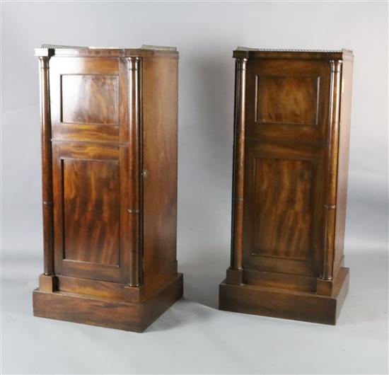 A pair of Regency mahogany inverse breakfront pillar cabinets, W.1ft 11in. D.1ft 9.5in. H.4ft 3in.